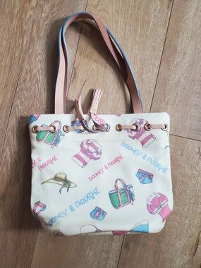 Dooney & Bourke Miami Beach Cream Drawstring Tote with Pink & Blue Accents
